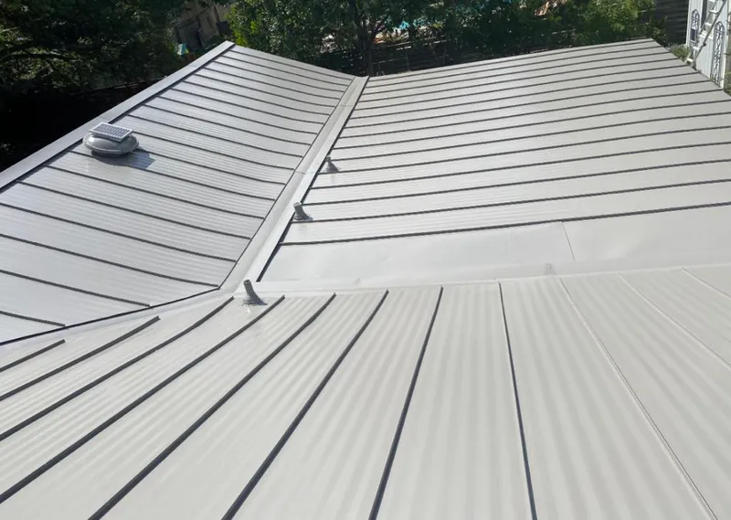 Solar attic fan installed on a metal roof for Roof Ventilation in Fort Hunt